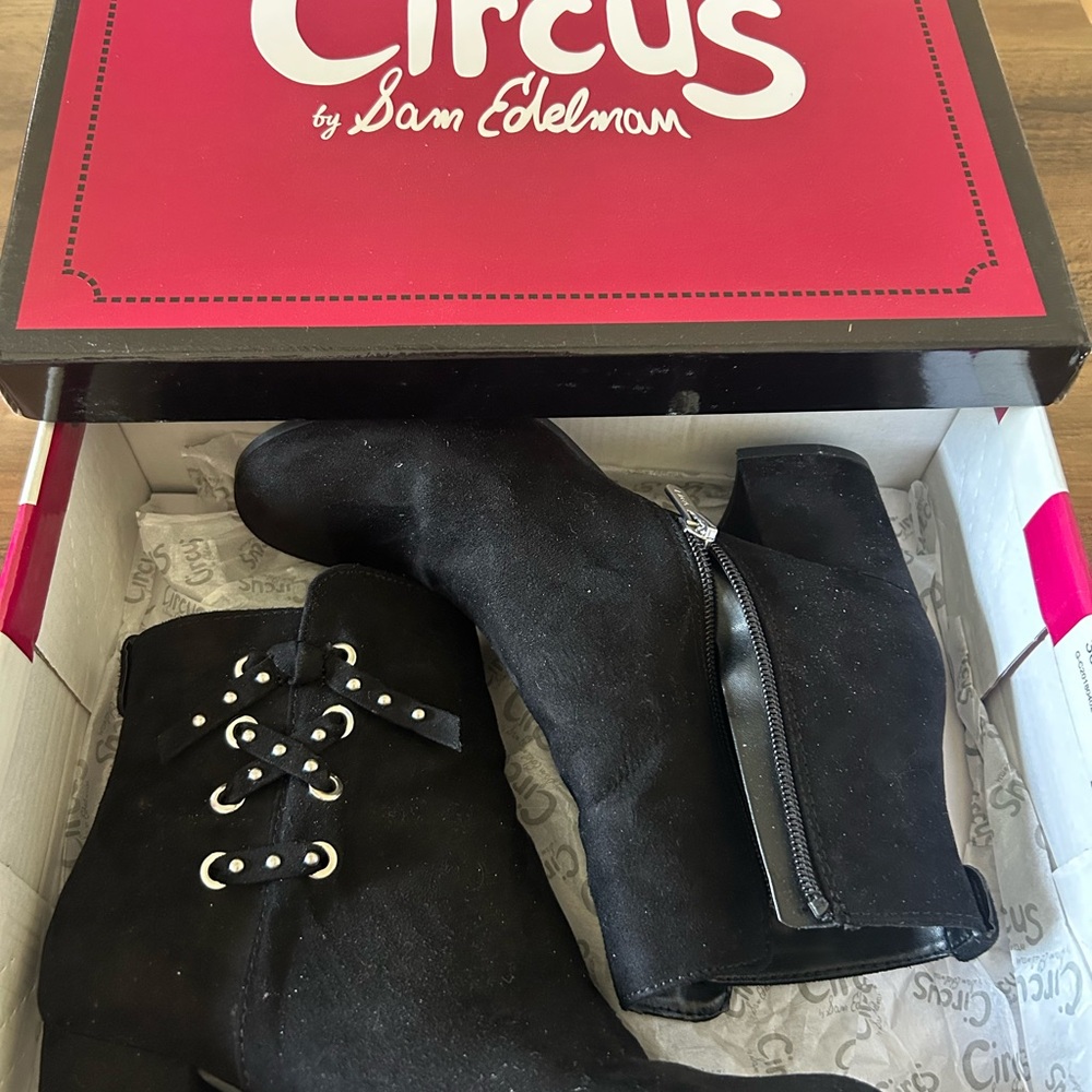 Black, suede like material, Sam Edelman boots with heel and silver accents.